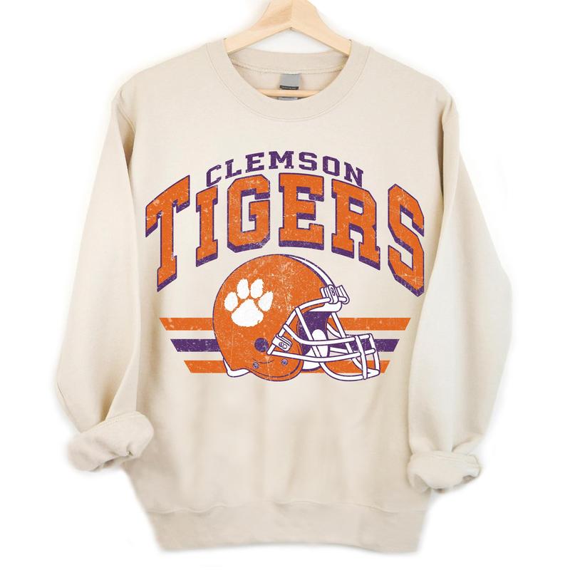 TikTok Shop Clemson Tigers Vintage Football NCAA Sweatshirt Clemson University Vintage Sweatshirt Vintage Sweatshirt NCAA Classic Sport Sweatshirt Unisex Gifts For Football Fan Sport Sweatshirt Hoodie...