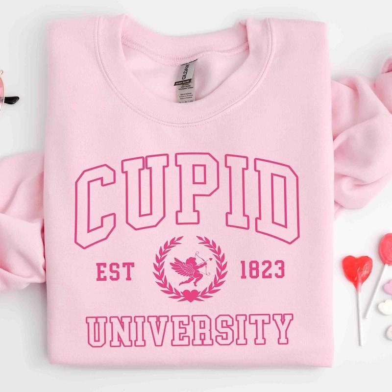 TikTok Shop Cupid University Sweatshirt Cute Valentine s Day Shirt Funny College Sweatshirt Love Crewneck Sweatshirt Cupid Sweater Stylish Hoodie And Funny Sweatshirt